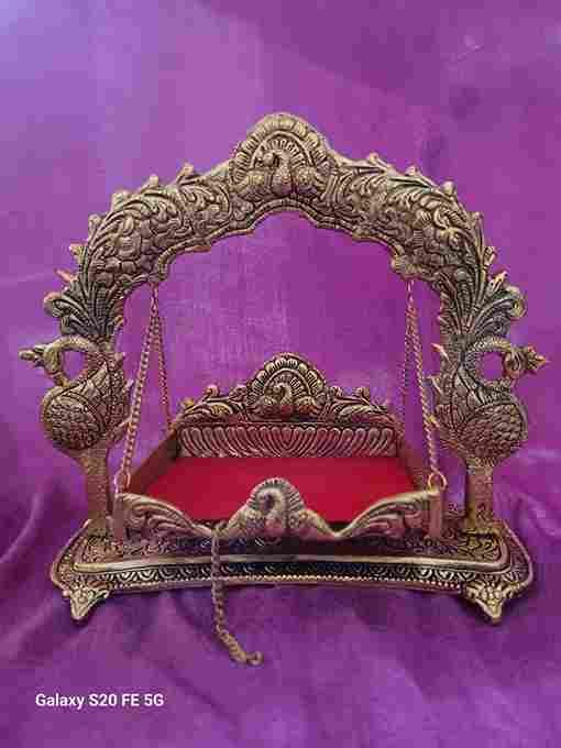 Metal jhula in new peacock theme available in 2 finish. Antique brass gold and german silver.  11inch